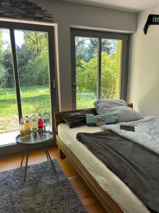 a bedroom with two beds and a table with drinks on it at Luxuriöses Villenanwesen in ruhiger Lage in Heroldsberg