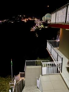 a view of a city at night from a building at FORTUNE HEIGHTS DALHOUSiE in Dalhousie