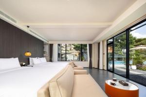 Postel nebo postele na pokoji v ubytování Hainan Ease Ocean Retreat + 65 fotografií