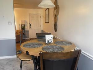 a dining room table with four chairs at Simply Home in Statesboro
