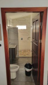 a bathroom with a shower and a toilet and a sink at Casa Boa Casita in La Abuela