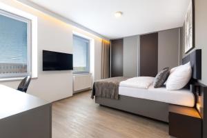 Ένα ή περισσότερα κρεβάτια σε δωμάτιο στο Hotel Awam