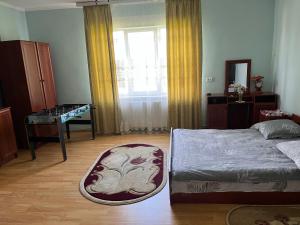 Ένα ή περισσότερα κρεβάτια σε δωμάτιο στο Домашній затишок +1 φωτογραφίες