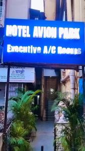 a sign that reads motel auction rates executive mg homes at Hotel Avion Park Executive in Mumbai