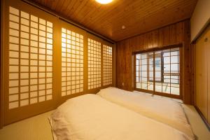 Postel nebo postele na pokoji v ubytování 空彩 -sorairo2- 札幌と富良野の中間