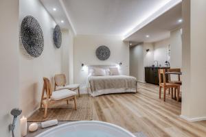 Ένα ή περισσότερα κρεβάτια σε δωμάτιο στο Wellness Suites