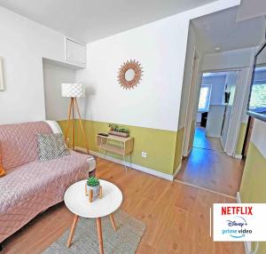 a living room with a couch and a table at Cosy appartement, Nancy center in Nancy
