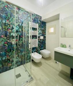 a bathroom with a shower and a sink and a toilet at B&B Iris in Terlizzi