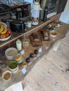 a table with various food items on it at Jardin de Epicuro in Colonia Chapadmalal