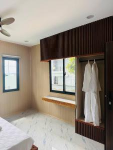 a bedroom with a bed and a window at Real Bungalow in Koh Rong