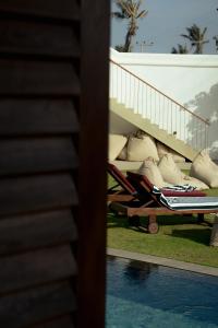 a view of a resort with a swimming pool at UNU Boutique Hotel -- Adults Only -- in Ahangama +30 photos