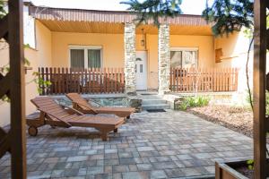 Κήπος έξω από το Vámos Apartman