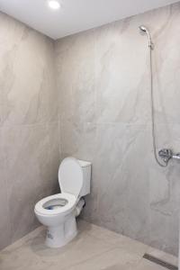 a bathroom with a toilet and a shower at 3 Min To Center Stylish Stay's in Tirana +23 photos