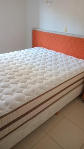 a mattress sitting on a bed in a room at Apartamento para Sammer Fest 2026 in Blumenau +12 photos