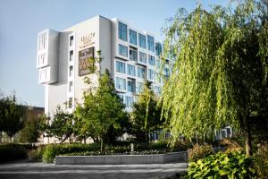 a building with trees in front of it at Tivoli Hotel in Copenhagen
