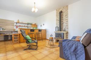 a living room with a couch and a table at Finca Rural House El Pajal Relax in Santa Úrsula +27 photos