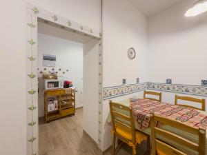 a dining room with a table and a microwave at casale nonna Elisa relax tra ulivi in San Vito Chietino