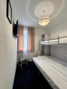 Postel nebo postele na pokoji v ubytování Dom Wczasowo Rekreacyjny Zgoda