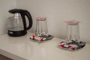 a counter with two coffee makers and a blender at Двухместная комната общая ванная, Double Room Shared Bathroom in Chişinău +33 photos