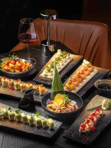 a table with many different types of food on it at Grand Sapphire Hotel, Casino & Spa Holiday Deluxe Residential Home in Iskele