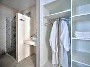 a bathroom with white towels and a shower at Villa Maria Naoussa in Naousa +24 photos