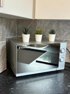 Kuchyň nebo kuchyňský kout v ubytování 4 Bedroom Hidden Gem, 5 mins to City Centre