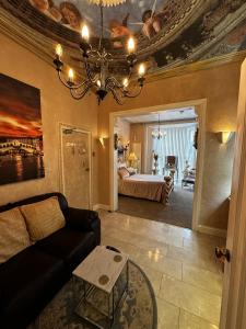 a living room with a couch and a bed at Spend this night in Venice whilst visiting Swansea in Swansea