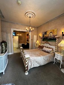 a bedroom with a large bed and a living room at Spend this night in Venice whilst visiting Swansea in Swansea