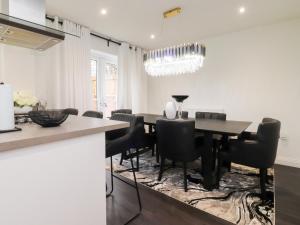 a dining room with a table and chairs at Mellings Place in Carnforth