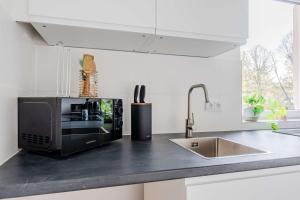 Køkken eller tekøkken på Modernes Apartment im Holländischen Viertel + 8 billeder