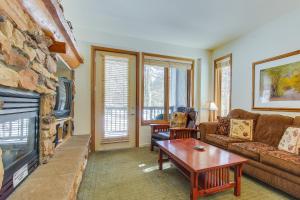 a living room with a couch and a fireplace at Mammoth Green 101 in Mammoth Lakes