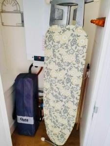 a snowboard leaning up against a wall in a room at Lovely Apartment Wassenaar 6P in Wassenaar