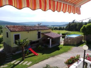 a view of a small house with a garden at Family friendly apartments with a swimming pool Cepic, Central Istria - Sredisnja Istra - 15878 in Kršan