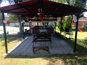 a gazebo with a picnic table under it at Rancho el Andariego and La Catrina 