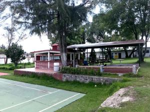a bus stop with a pavilion in a park at Rancho el Andariego and La Catrina 