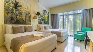 Postel nebo postele na pokoji v ubytování Gran Evenia Bijao - All Inclusive