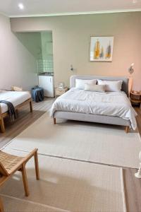 a bedroom with a large bed and a rug at Résidence Rachel 12 in Mons +144 photos