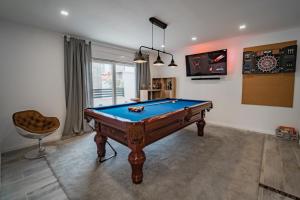 a billiard room with a pool table in a room at Seaside luxury villa with a swimming pool Razanj, Rogoznica - 23572 in Rogoznica