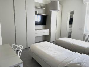 Ένα ή περισσότερα κρεβάτια σε δωμάτιο στο Domus Pyrus Apartments