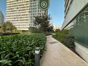 a sidewalk next to a building with a sign on it at 1BR Condo in Polanco - Pool - Coworking - CityView in Mexico City