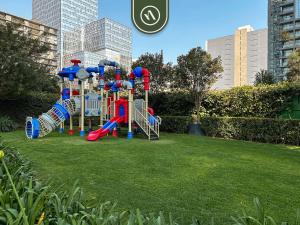 a playground in a park in a city at 1BR Condo in Polanco - Pool - Coworking - CityView in Mexico City