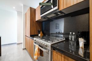 Η κουζίνα ή μικρή κουζίνα στο Luxurious 1BR Condo Near Reforma - Pool - Gym