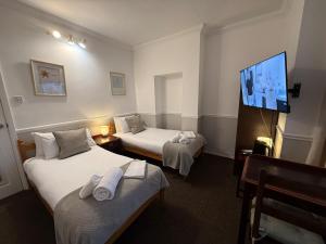 Postel nebo postele na pokoji v ubytování Central Hotel