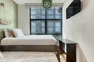 En eller flere senge i et værelse på Centric 2 BR Condo - Gym - Open Air Cinema + 35 billeder