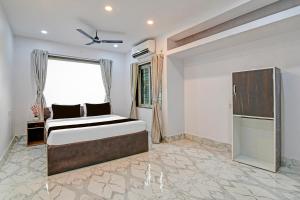 Giường trong phòng chung tại Hotel O AI HOTEL