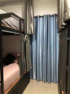 Postel nebo postele na pokoji v ubytování Den Nest Guest House Krabi