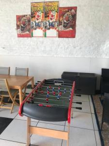 a pool table in the middle of a room at La Fermette Aux Lamas in Savigny-Lévescault