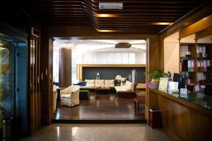 a view of a living room with a couch and a living room at Hotiday Conegliano in Conegliano