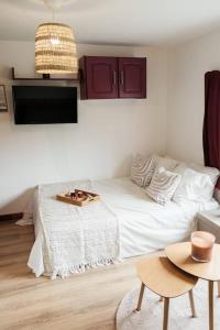 a living room with a bed and a table at Altitude 1745 - Mountain view in Font-Romeu