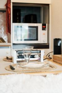 a microwave oven sitting on top of a kitchen counter at Altitude 1745 - Mountain view in Font-Romeu